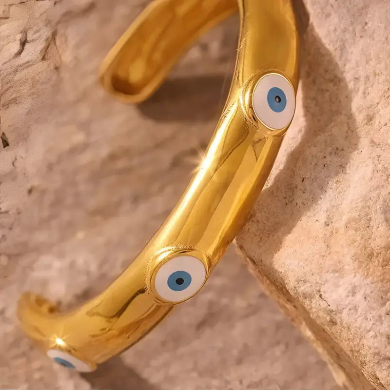 Elevate Your Look with Theora & Co’s 18k Gold Evil Eye Bangle